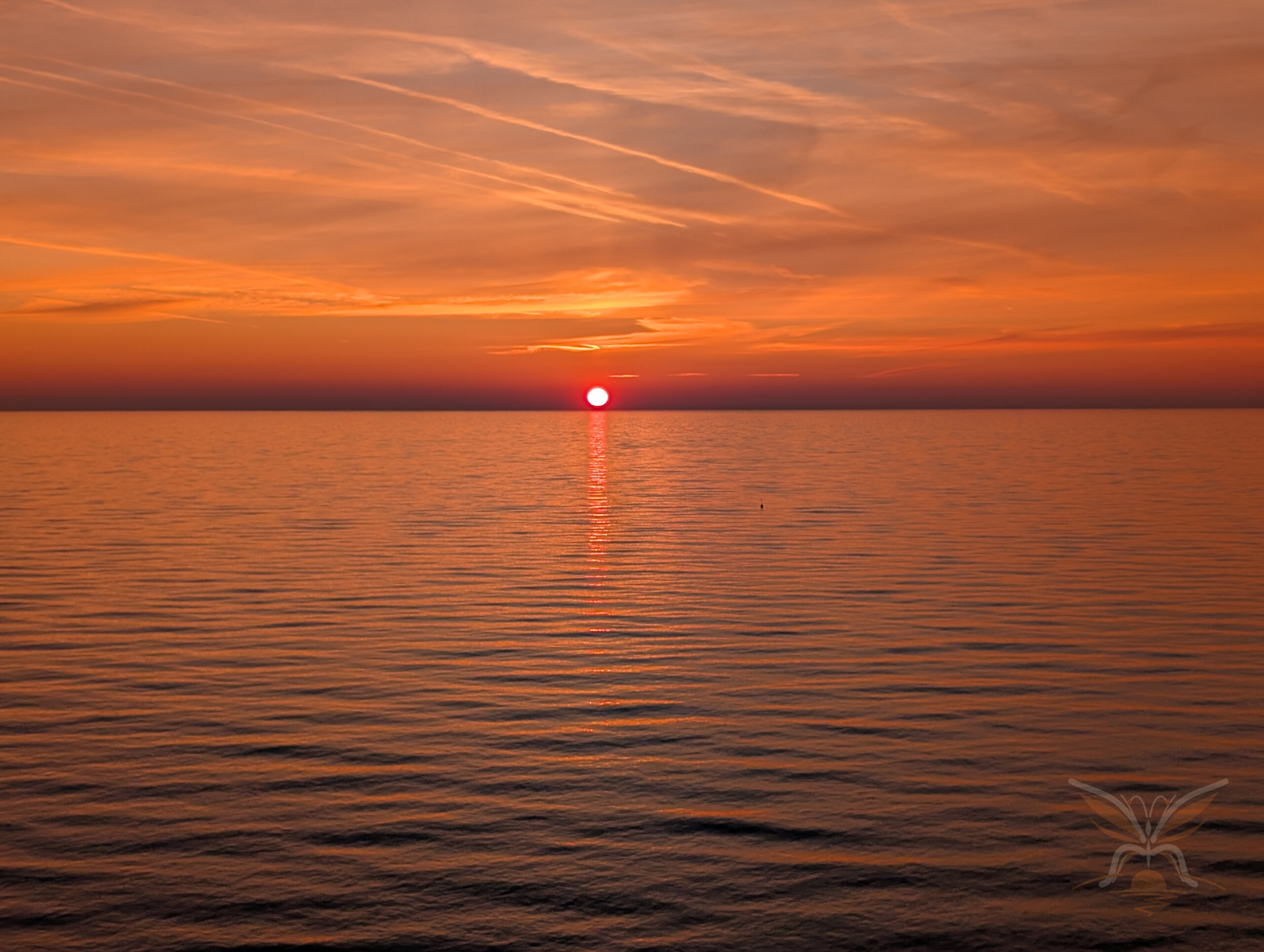 Orange sunset over the Black Sea seen from Batumi Boulevard, Georgia.