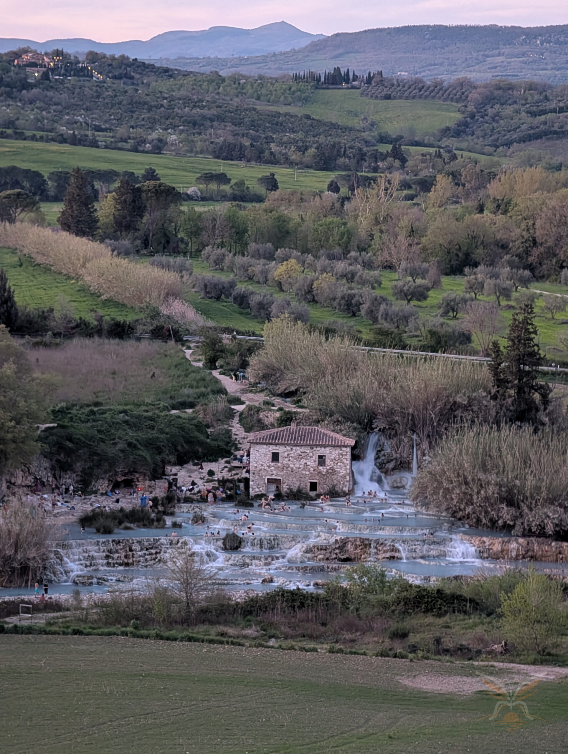 Natural thermal pools and the stone mill at Cascate del Mulino in Saturnia, Tuscany.