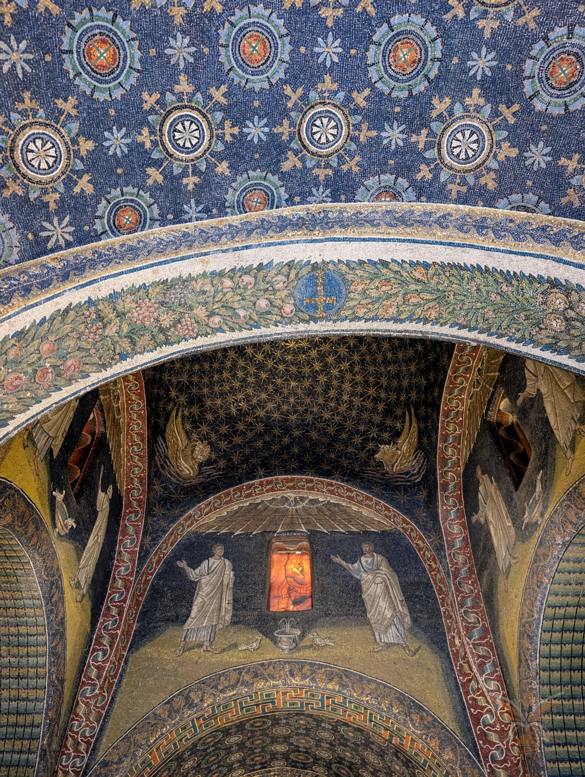 Fifth-century mosaics and starry blue vault inside the Mausoleum of Galla Placidia in Ravenna.