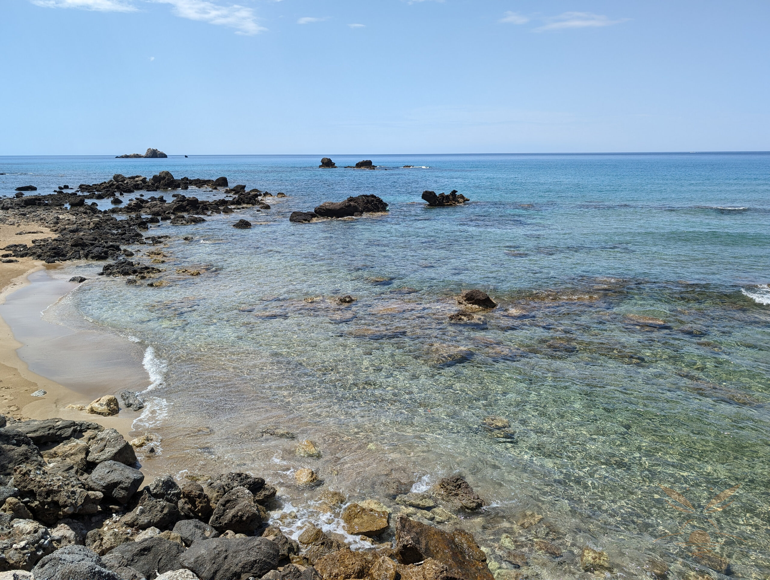 Clear shallow water and rocks along the coast of Sardinia, Italy.