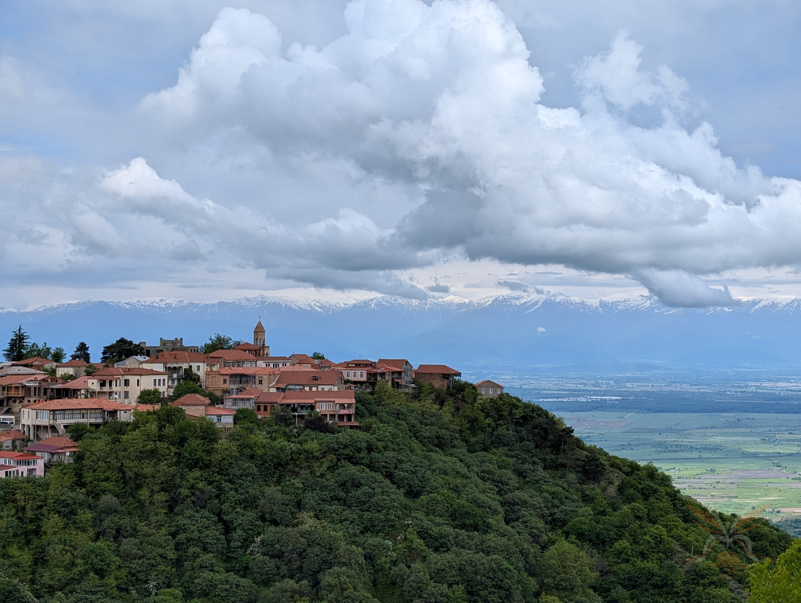 View of Sighnaghi overlooking the Alazani Valley and the snow-capped Caucasus Mountains in Georgia.