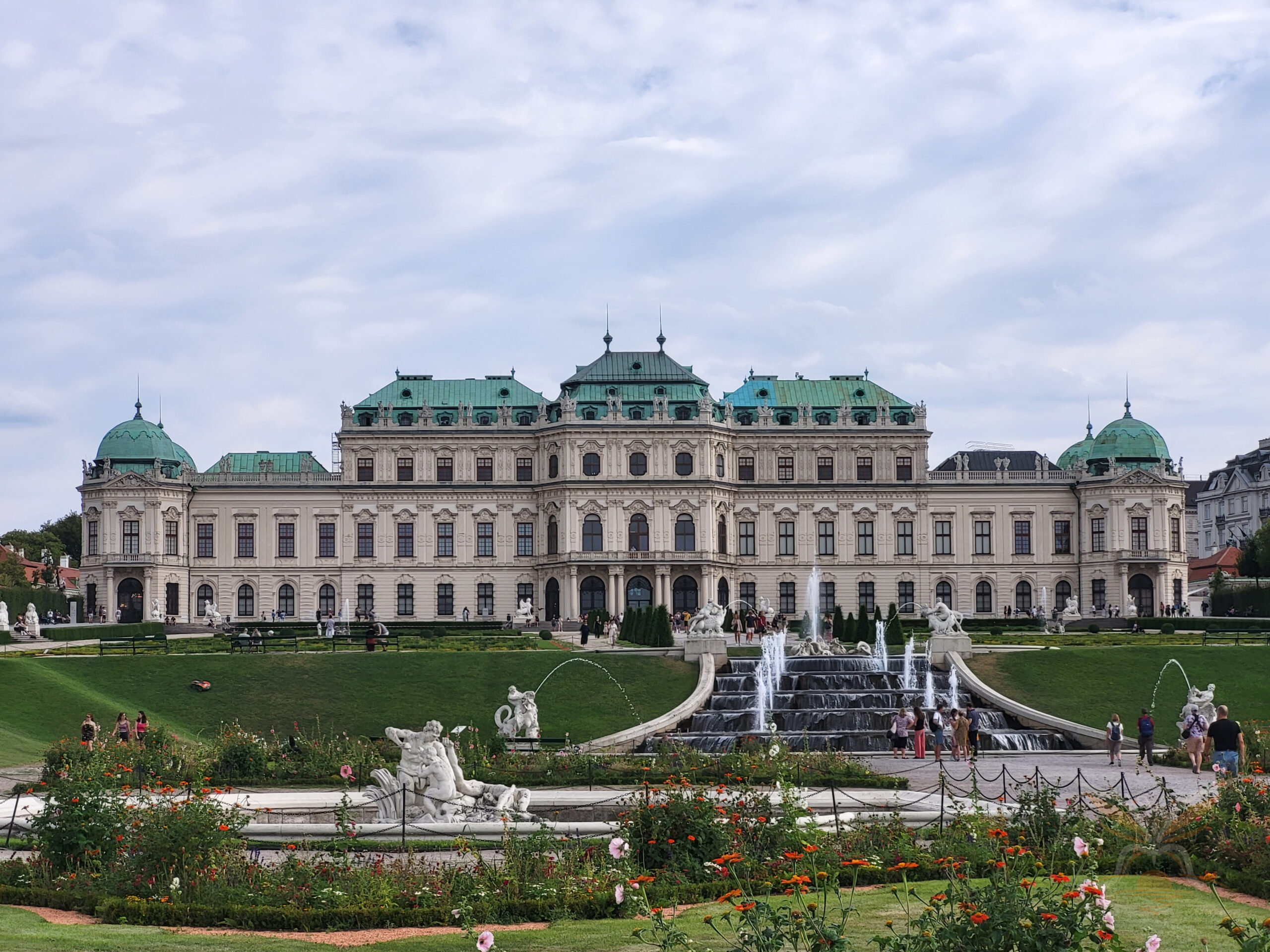 Upper Belvedere palace beyond formal gardens and fountains in Vienna, Austria.
